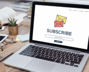 Laptop open on a table with the word subscribers listed