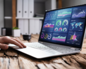 laptop on a table showing data analytics